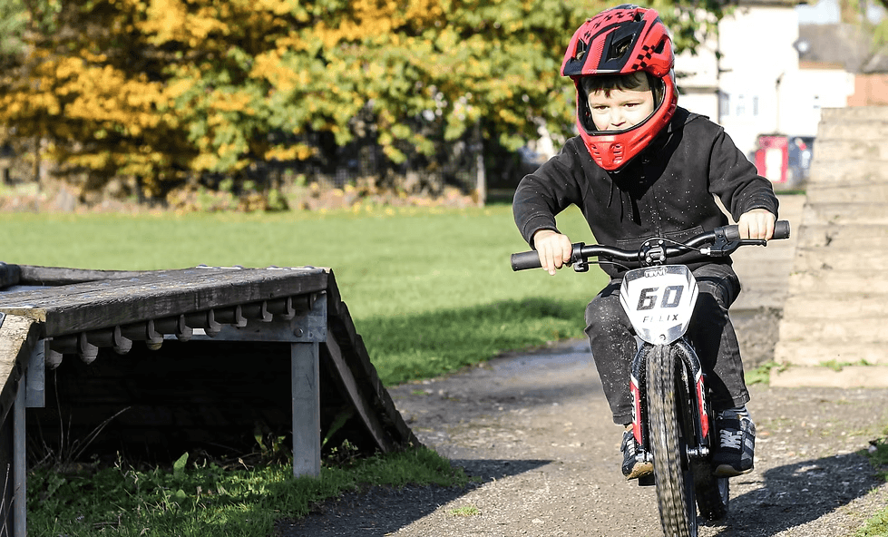 Child riding Revvi electric bike